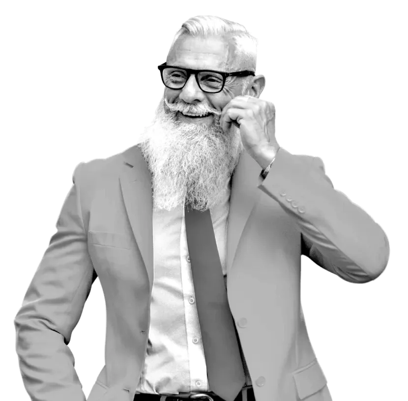 A man wearing a suit and touching his moustache