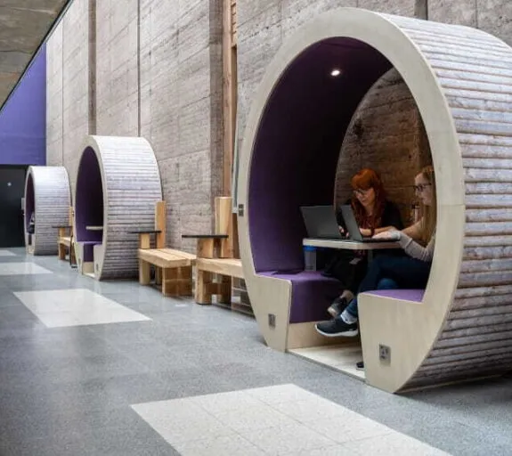 Two people working in a booth