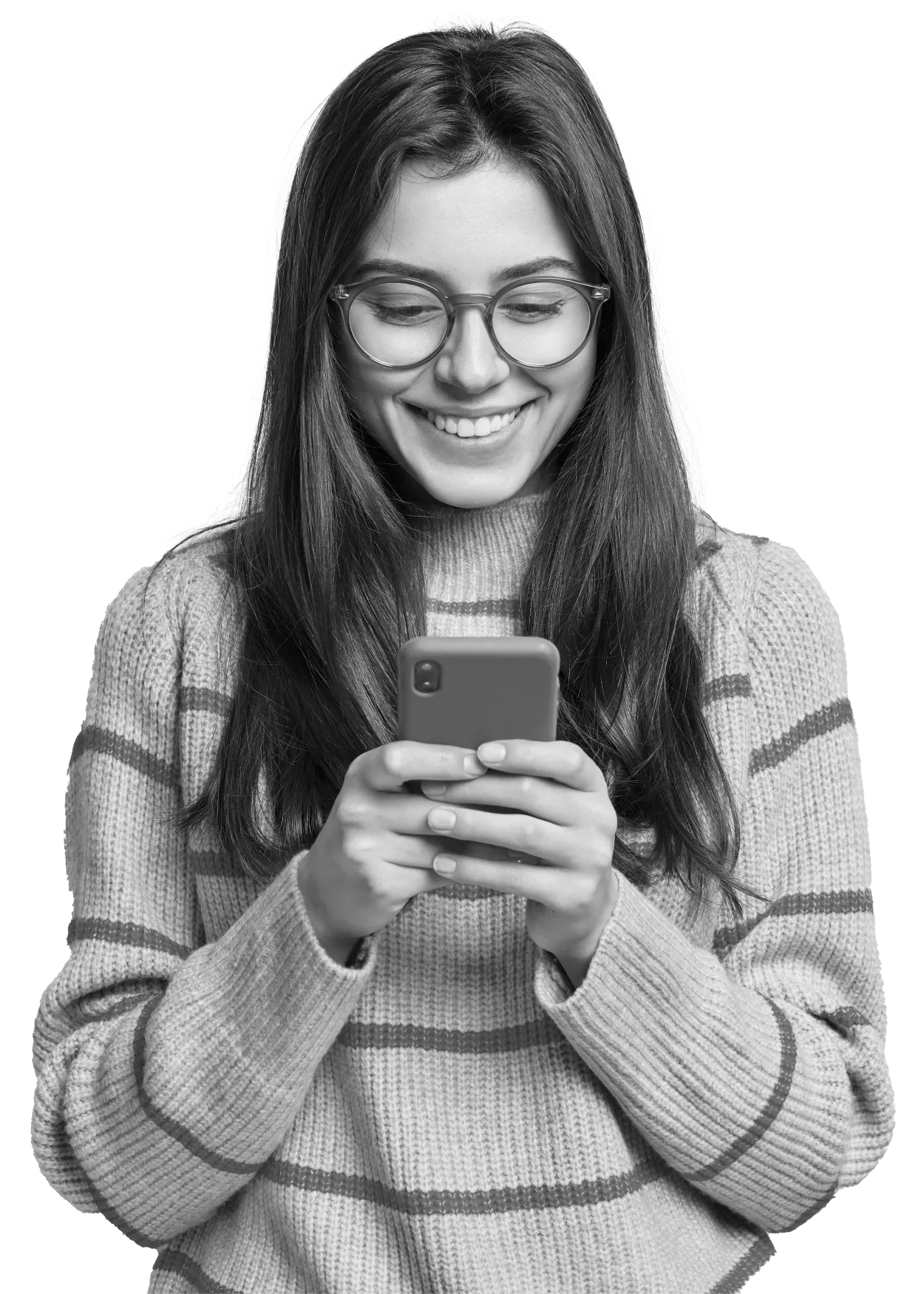 A person in glasses and a striped sweater smiling at their phone.