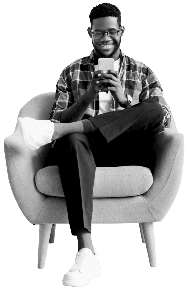 A man sitting down whilst on phone