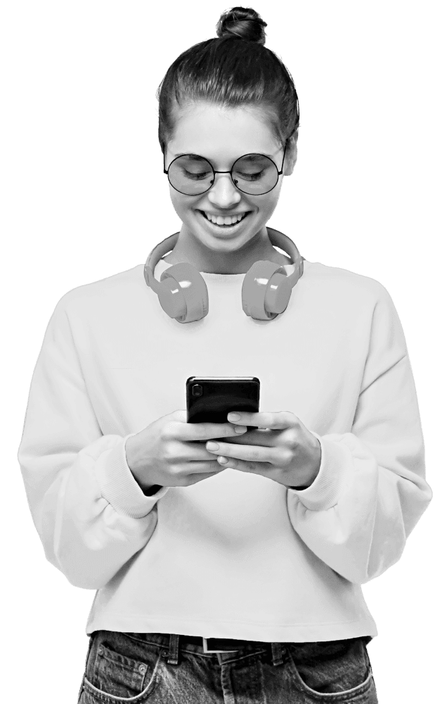 Woman on phone with headphones around neck