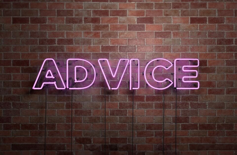 Neon sign with the word 'advice' capitalised, mounted on a brick wall