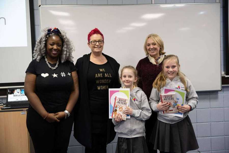 Two of the girls standing for a photo with the Stemettes