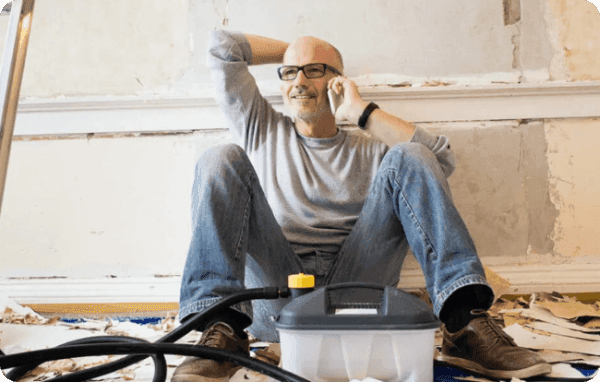 Man on phone to Atom bank to discuss Money worries