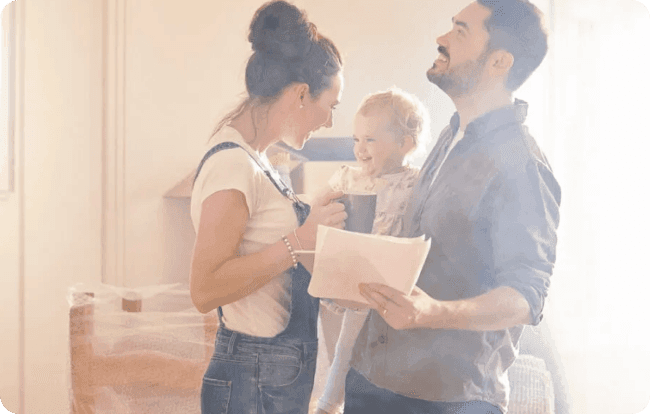 Young family in their new home after getting an Atom bank mortgage