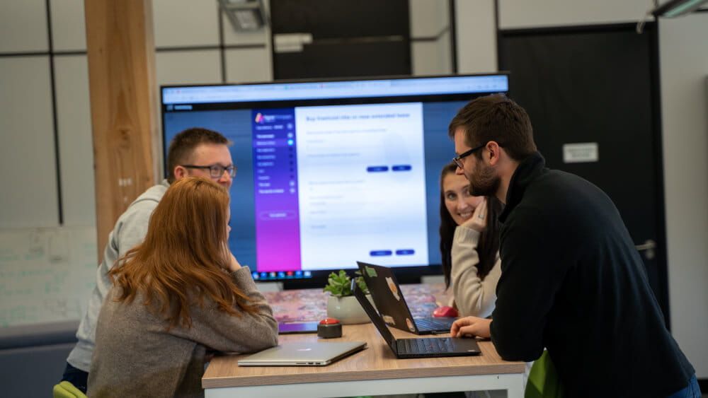 four people in meeting