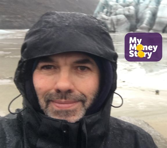 Man stands on beach in the rain