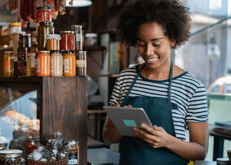 Young business owner using her IPad to apply for an Atom RLS loan