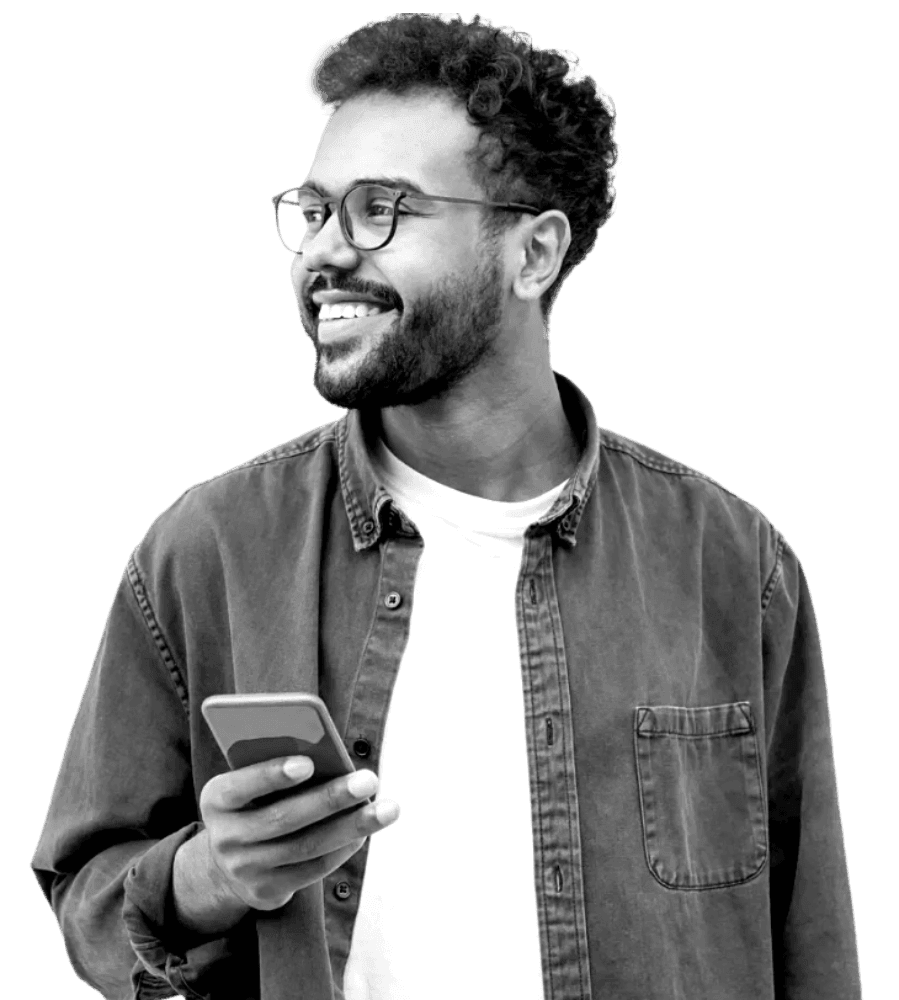 Man smiling looking away from phone