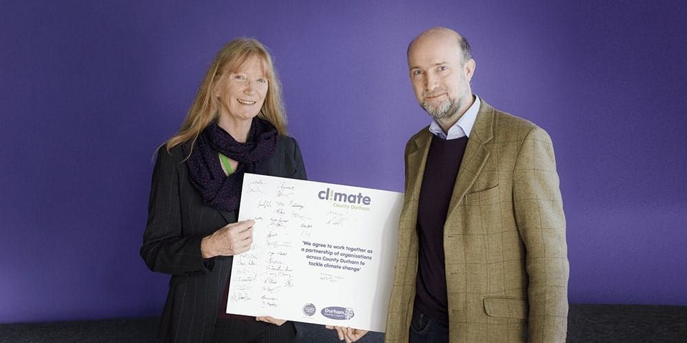 Edward Twiddy, Atom bank's CCO, holding the Climate pledge he has just signed on behalf of Atom bank