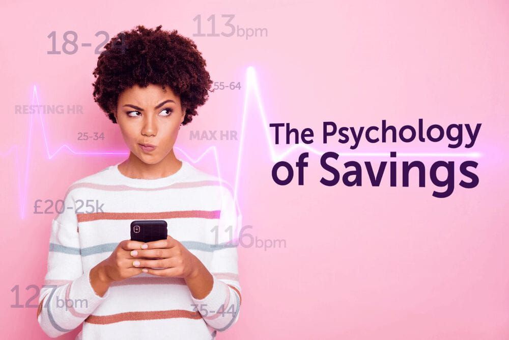 Woman stands holding her phone with a perplexed look. Around her are a lot of numbers and a heart beat wave. The words read The psychology of savings