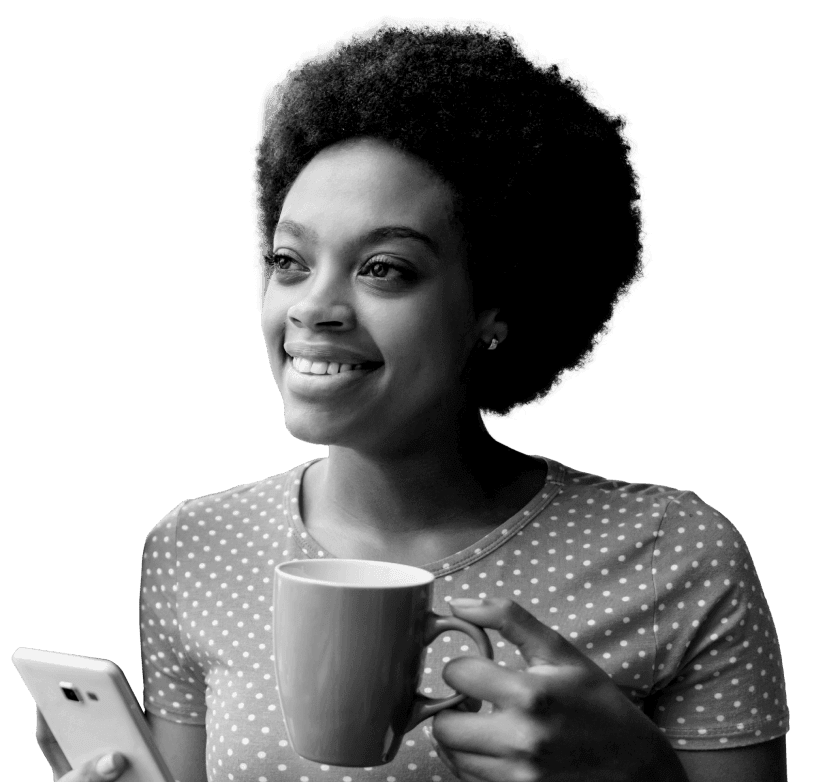 Woman holding coffee mug and phone.png