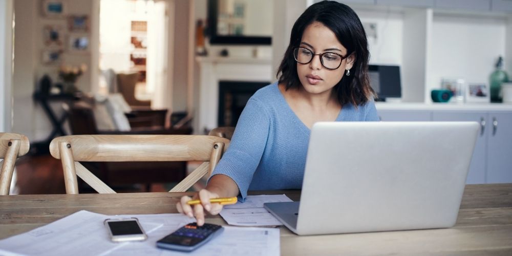 Woman setting up a single person mortgage on her laptop